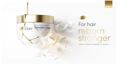 มาส์กบำรุงผม Dove Intensive Repair หนึ่งกระปุก ข้อความเขียนว่า ‘ฟื้นฟูเส้นผมให้แข็งแรงขึ้นจาก 10 สัญญาณความเสียหายภายใน 1 นาที’